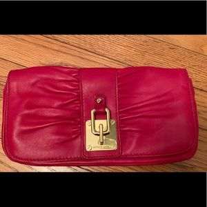 Michael Kors Red leather clutch. Never Used